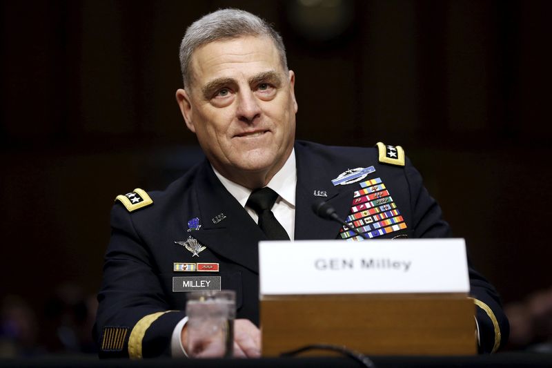 © Reuters. U.S. Army General Mark Milley smiles as he begins his testimony at a Senate Armed Services Committee hearing on his nomination to become the Army's chief of staff, on Capitol Hill in Washington