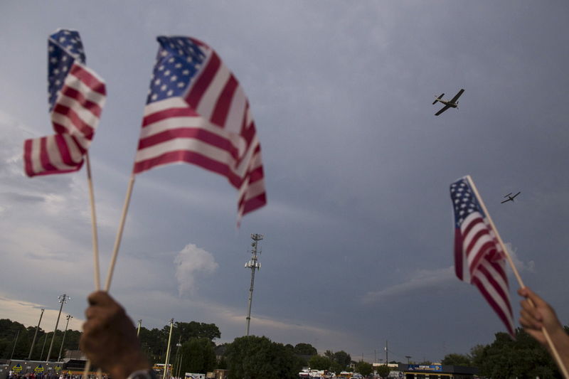 © Reuters. Military planes do a fly-over during a vigil for Marine Lance Cpl. Squire K. "Skip" Wells, one of the five military servicemen slain last week in Chattanooga in a domestic terror attack, at Sprayberry High School in Marietta