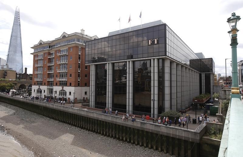 © Reuters. A company logo hangs on the headquarters of the Financial Times newspaper in London