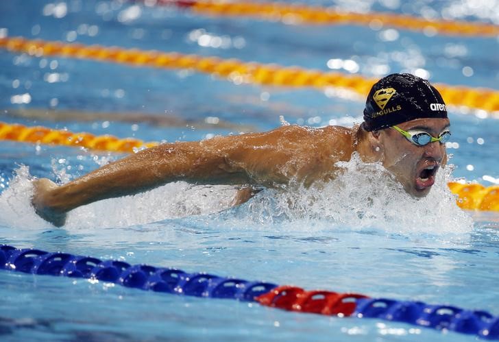 © Reuters. Chad Le Clos of South Africa swims to win the men's 100m butterfly event of the FINA Swimming World Cup at the Aquatic Centre in Singapore