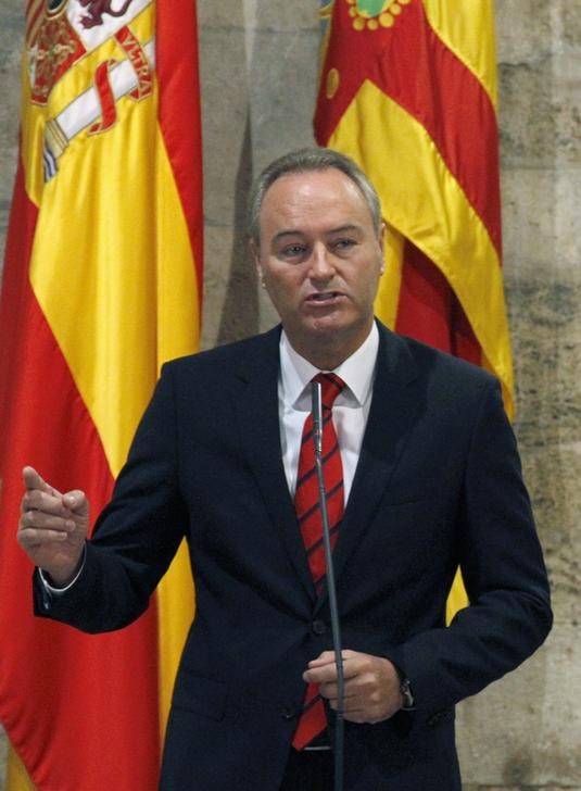 © Reuters. Fabra, president of the Valencia region, talks to the media after the regional government announced the closure of public broadcaster RTVV, in Valencia