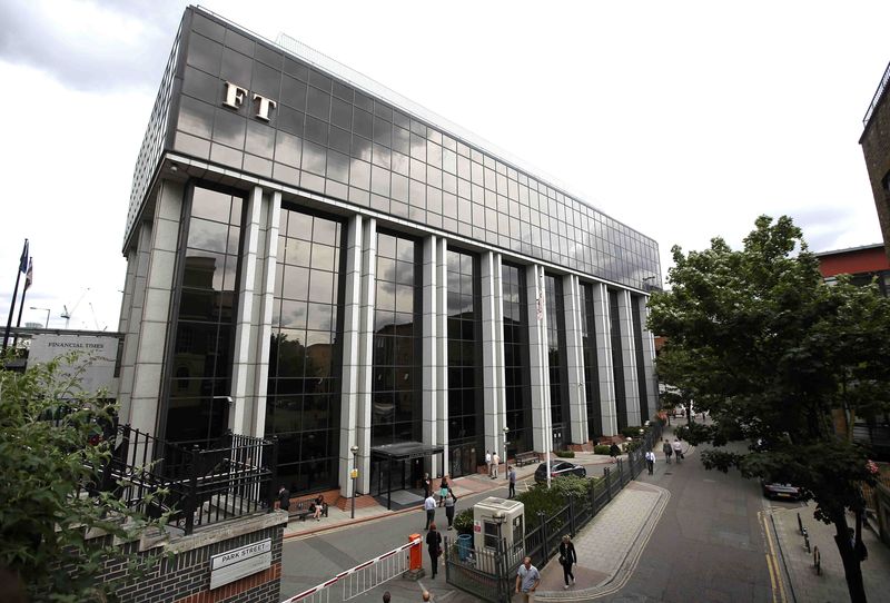 © Reuters. A company logo hangs on the headquarters of the Financial Times newspaper in London