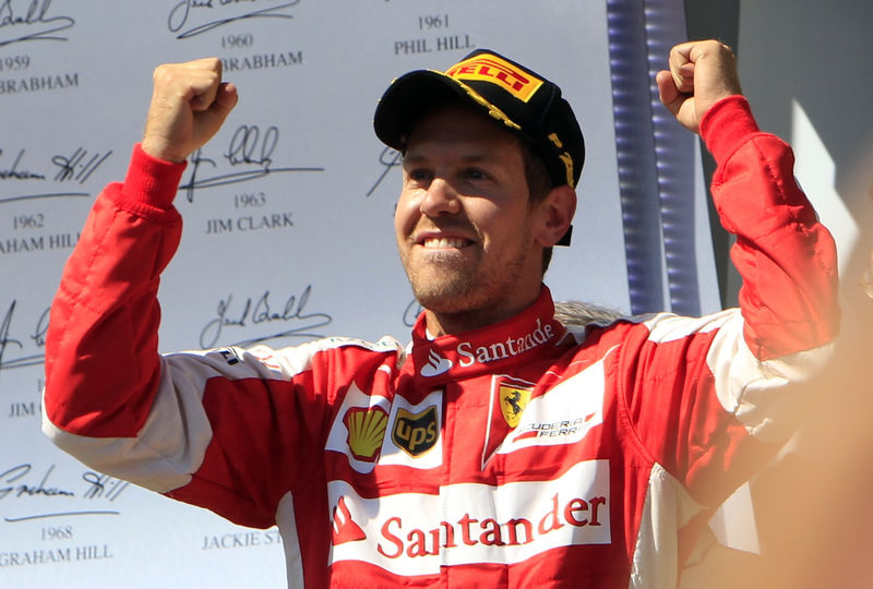 © Reuters. Winner Ferrari Formula One driver Vettel of Germany celebrates after the Hungarian F1 Grand Prix at the Hungaroring circuit, near Budapest