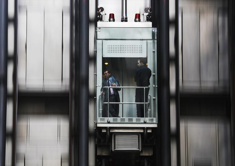 © Reuters. People travel in a lift at the Lloyds of London building in the financial district of the City of London