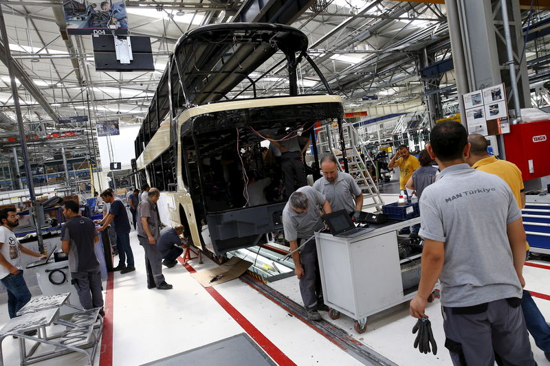 © Reuters. Employees work at the assembly line of the MAN Bus Production Center in Ankara