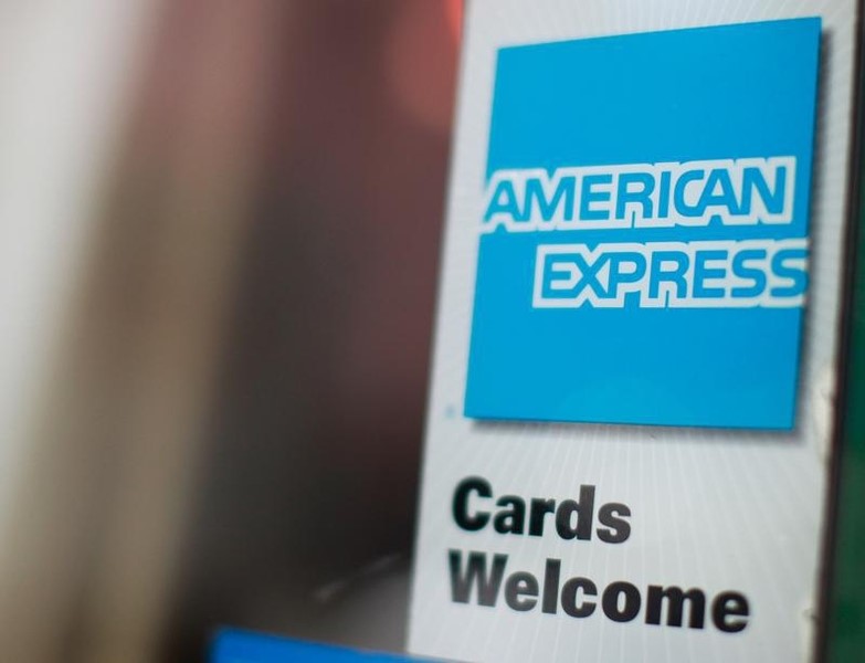 © Reuters. An American Express sign is seen on a restaurant door in New York