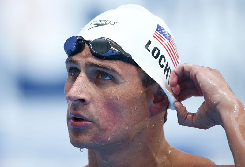 © Reuters. Lochte of the U.S. reacts after men's 200m individual medley heat at Aquatics World Championships in Kazan