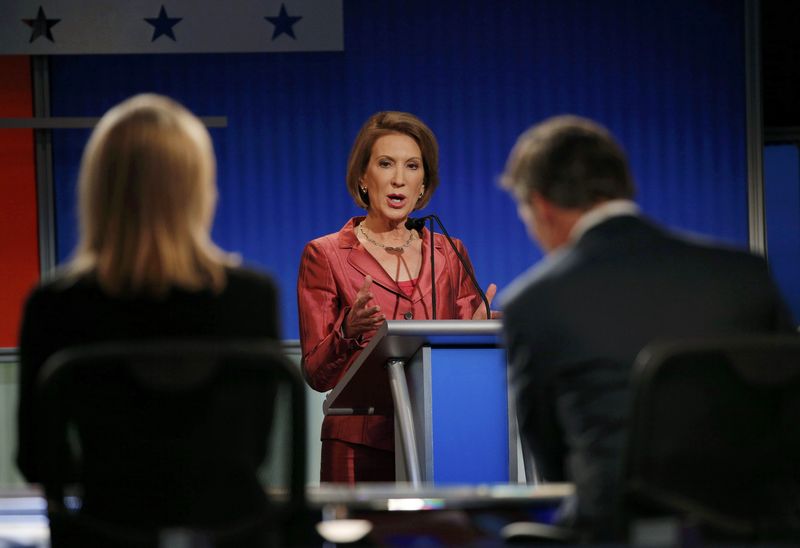 © Reuters. Republican presidential candidate Carly Fiorina responds to a question at a forum for lower polling candidates held before the first official Republican presidential candidates debate of the 2016 U.S. presidential campaign in Cleveland