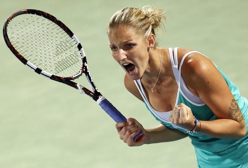 © Reuters. Karolina Pliskova of the Czech Republic celebrates after beating Garbine Muguruza of Spain in their women's singles tennis semi-final match at the WTA Dubai Tennis Championships