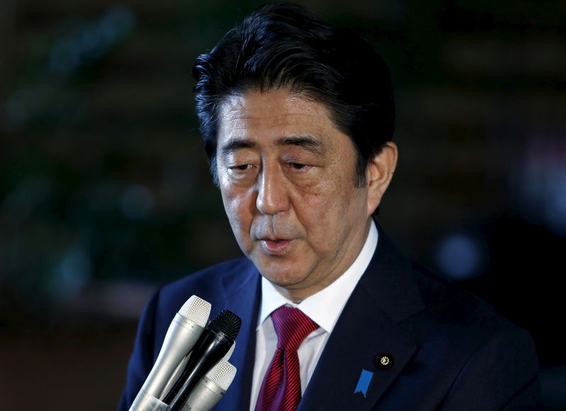 © Reuters. Japan's Prime Minister Abe speaks to reporters after meeting with Mori, Japan's former Prime Minister and president of the Tokyo 2020 Organizing Committee of Olympic and Paralympic games, at Abe's official residence in Tokyo