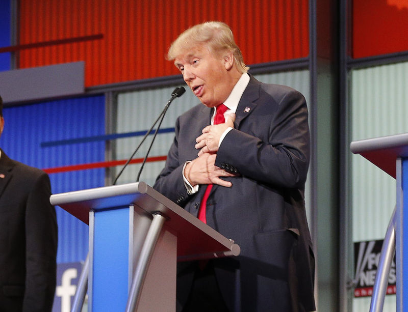 © Reuters. Republican 2016 U.S. presidential candidate and businessman Donald Trump reacts near the end of the first official Republican presidential candidates debate of the 2016 U.S. presidential campaign in Cleveland