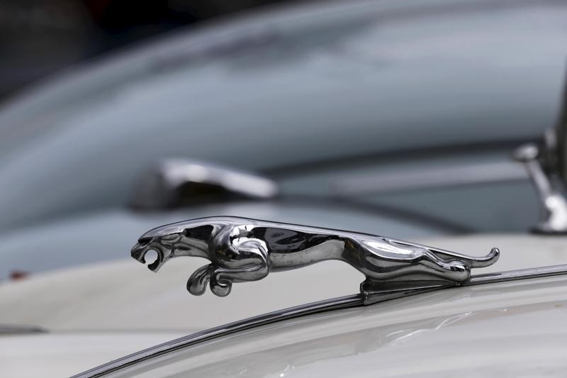© Reuters. The Jaguar emblem is seen on a historical car that took part in the "Amber Trophy" rally at the City Square in Riga