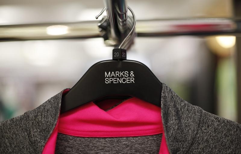 © Reuters. Clothes are displayed on hangers in an M&S shop in northwest London