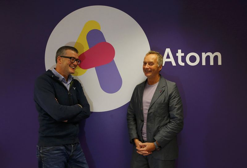 © Reuters. Atom Bank Chief Executive Officer Mark Mullen and Chairman Anthony Thomson pose for a photograph at their headquarters in Durham
