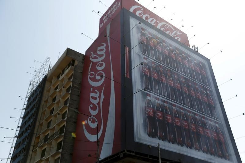 © Reuters. Coca-Cola publicity is seen on a building in downtown Lima