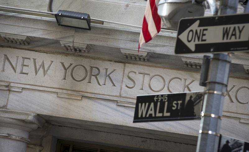 © Reuters. A Wall St. sign is seen outside the entrance of NYSE