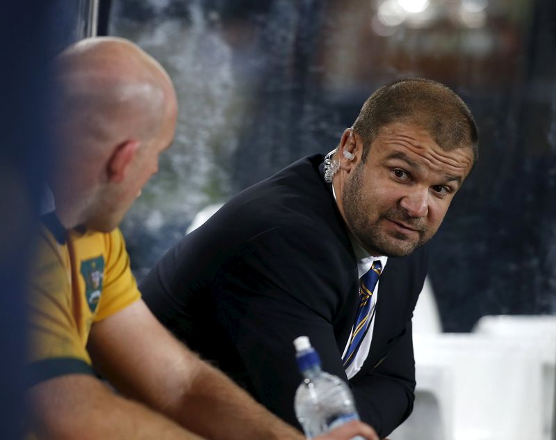 © Reuters. Australia's coach Michael Cheika talks with Stephen Moore while playing New Zealand's All Black's during their Bledisloe Cup rugby match at Eden Park in Auckland