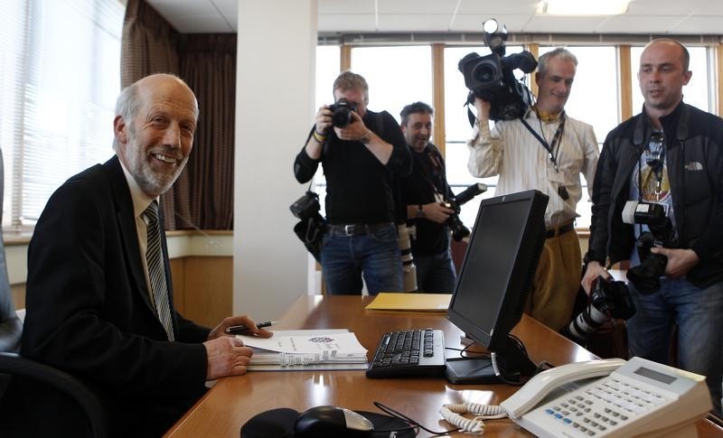 © Reuters. Alliance Party leader Ford poses in his Castle Buildings offices after he was elected as the first Justice Minister of Northern Ireland