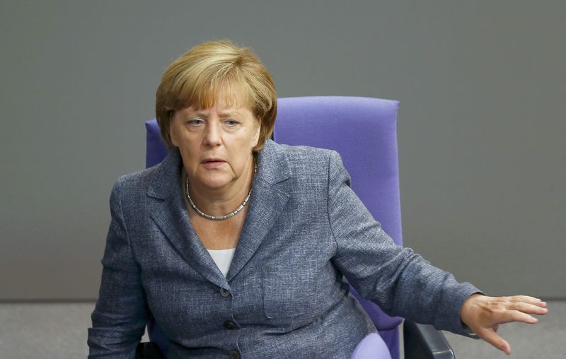 © Reuters. German Chancellor Merkel attends Bundestag session prior to vote on Greece's third bailout programme in Berlin