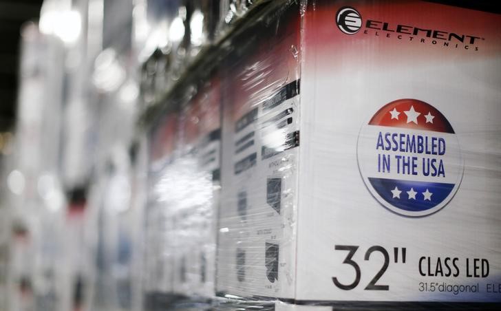 © Reuters. An "Assembled in the USA" stamp is seen at the side of a box containing a 32-inch TV set in the warehouse of Element Electronics, in Winnsboro