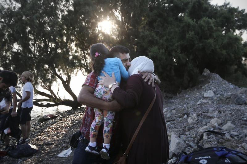 © Reuters. Una famiglia di rifugiati siriani 