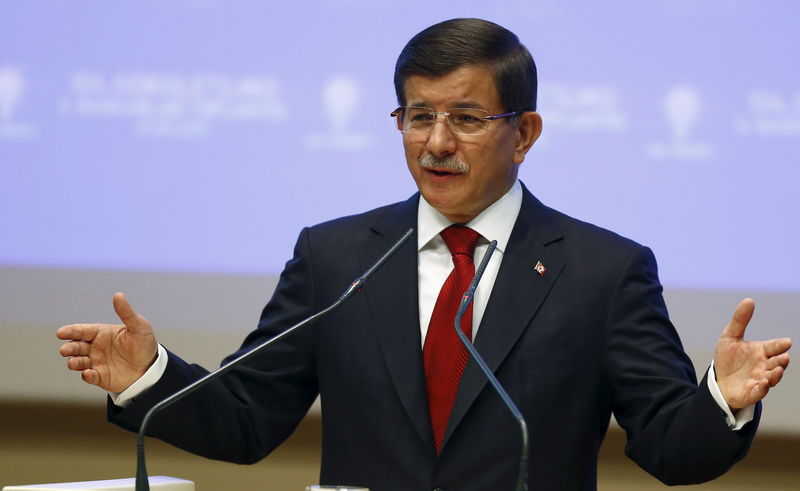 © Reuters. Davutoglu speaks during a meeting at his ruling AK Party headquarters in Ankara