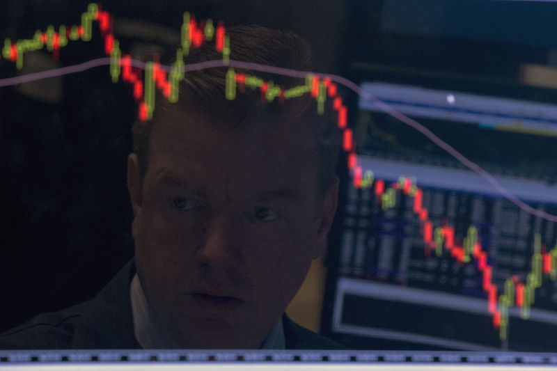© Reuters. A specialist trader is reflected on his screen on the floor of the New York Stock Exchange