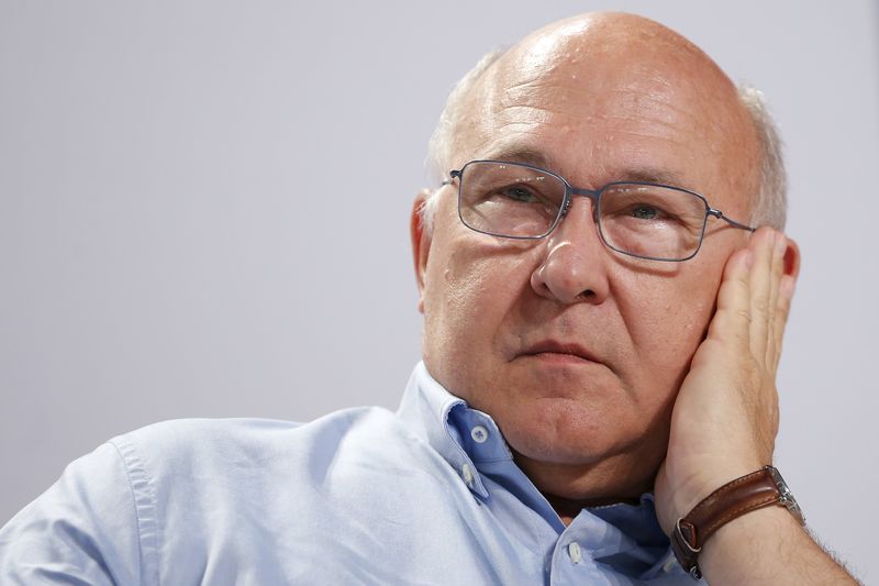 © Reuters. French Finance Minister Michel Sapin attends the Socialist Party's "Universite d'ete" summer meeting in La Rochelle