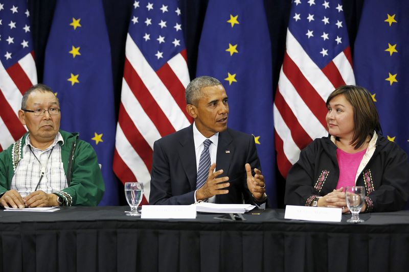 © Reuters. Obama is flanked by Naneng and Bahnke as he participates in a roundtable with Alaska natives before delivering remarks to the GLACIER Conference at the Dena'ina Civic and Convention Center in Anchorage, Alaska