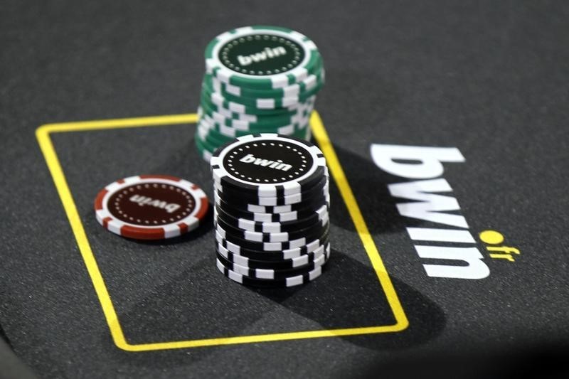 © Reuters. Betting company Bwin Interactive Entertainment AG logo is pictured with chips on a poker table during an event in Paris