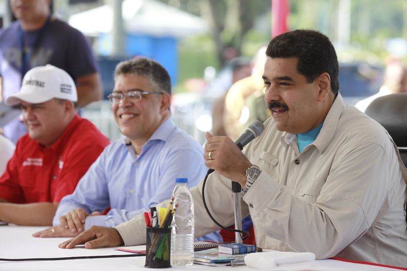 © Reuters. Handout photo of Venezuela's President Maduro speaking during a ceremony where subsidized taxis are distributed to beneficiaries in Caracas