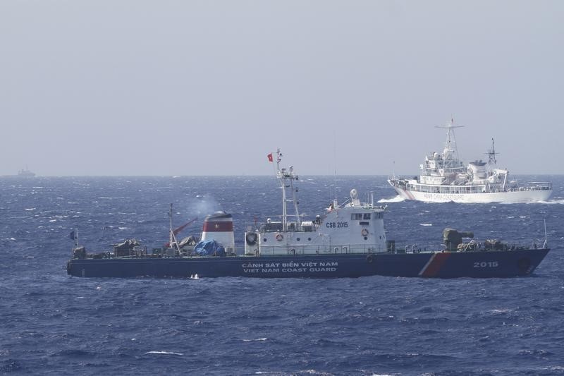 © Reuters. A ship of Chinese Coast Guard is seen near a ship of Vietnam Marine Guard in the South China Sea