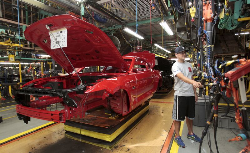 © Reuters. The frame of a 2015 Ford Mustang vehicle moves down the production line at the Ford Motor Flat Rock Assembly Plant in Flat Rock, Michigan,