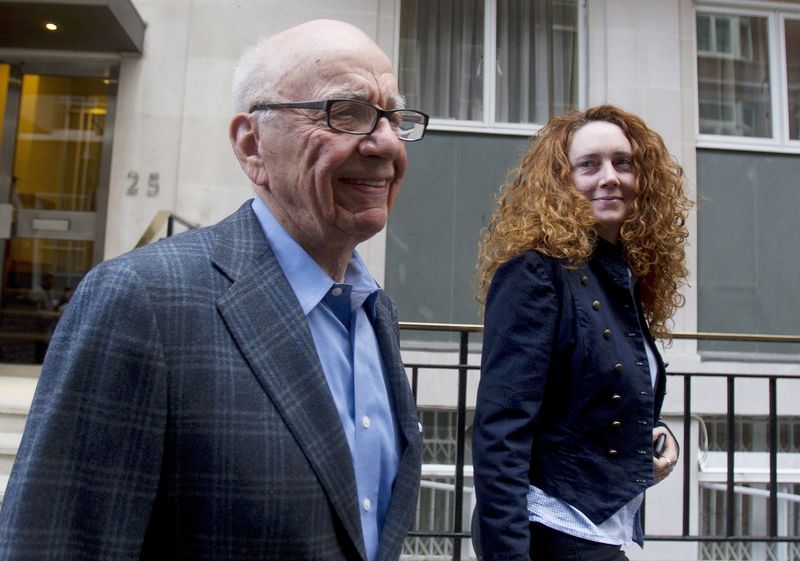 © Reuters. File photograph shows News Corporation CEO Rupert Murdoch leaving his flat with Rebekah Brooks, chief executive of News International,  in central London