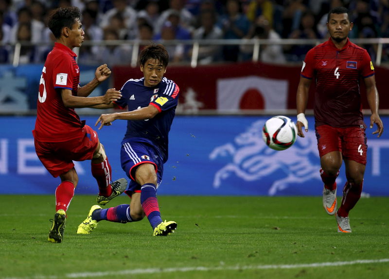 © Reuters. Japan's Kagawa kicks the ball during their 2018 World Cup qualifying soccer match against Cambodia at Saitama Stadium in Saitama