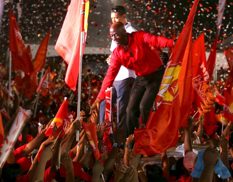 © Reuters. Keith Rowley, leader of the People's National Movement (PNM),greets supporters at a political rally at the Eddie Hart ground in Tacarigua