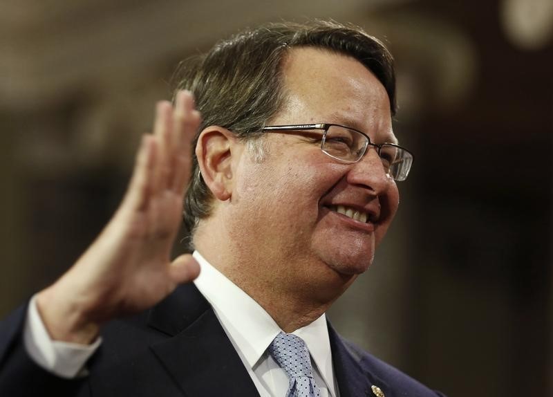 © Reuters. U.S. Senator Gary Peters smiles as he is ceremonially sworn-in by Vice President Joseph Biden in the Old Senate Chamber on Capitol Hill in Washington