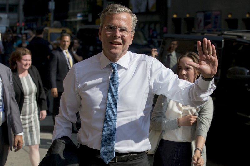 © Reuters. Republican presidential candidate Bush arrives for an appearance on "The Late Show with Stephen Colbert" at the Ed Sullivan Theater in Manhattan, New York