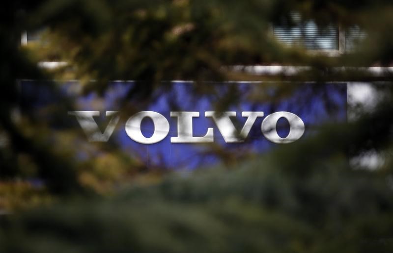 © Reuters. Volvo logo is seen through trees at a dealer's shop in Beijing