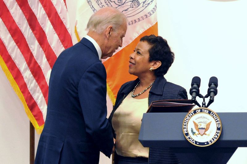 © Reuters. U.S. Vice President Joe Biden greets U.S. Attorney General Loretta B. Lynch at a news conference where they appeared along with Manhattan Distict Attorney Cyrus R. Vance in New York