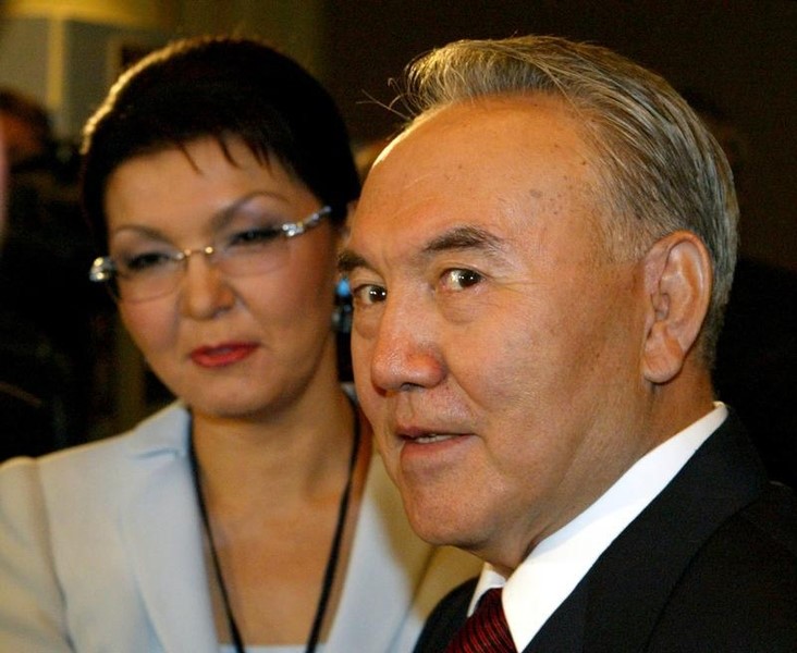 © Reuters. Kazakh President Nazarbayev looks on standing next to his daughter Dariga during opening of the ...