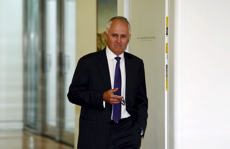 © Reuters. File photo of Malcolm Turnbull walking out of a government party room meeting in Canberra's Parliament House