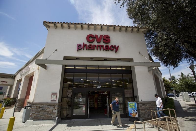 © Reuters. People walk outside a CVS store in Pasadena