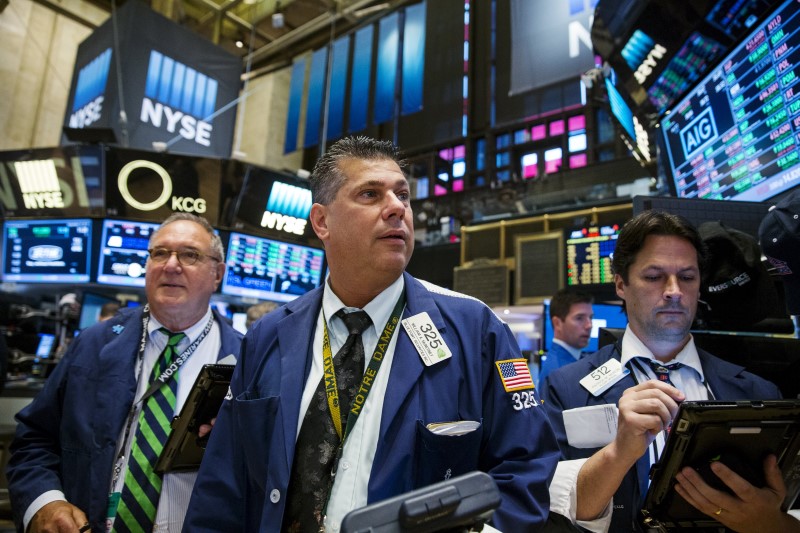 © Reuters. Traders work on the floor of the New York Stock Exchange shortly after the opening of the markets in New York