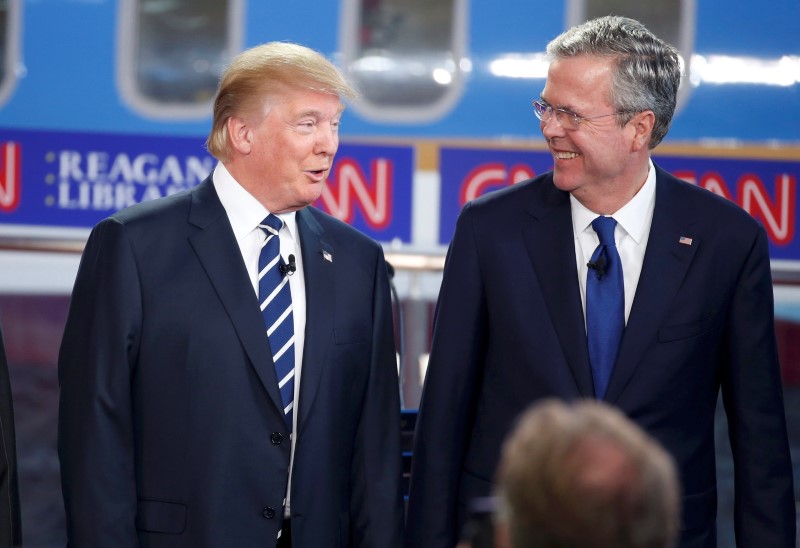 © Reuters. Republican U.S. presidential candidates Trump and Bush talk onstage before the start of the second official Republican presidential candidates debate at the Ronald Reagan Presidential Library in Simi Valley