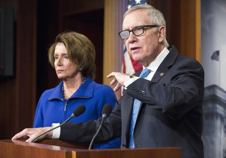 © Reuters. Senate Minority Leader Harry Reid (D-NV) and House Democratic Leader Nancy Pelosi (D-CA) speak during a news conference to discuss funding for the Department of Homeland Security