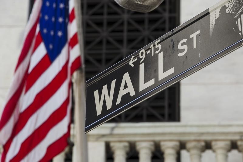 © Reuters. U.S. flag hangs above the door of the New York Stock Exchange
