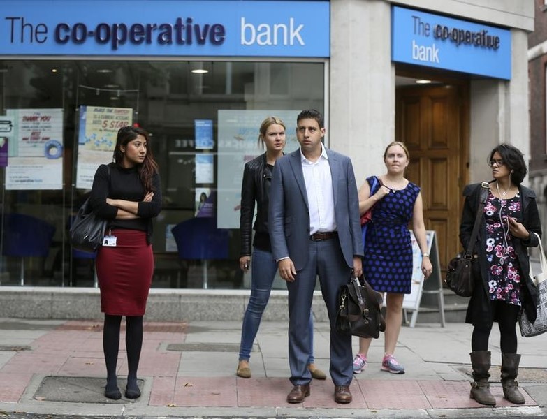 © Reuters. People walk past a branch of the Co-Operative Bank in central London