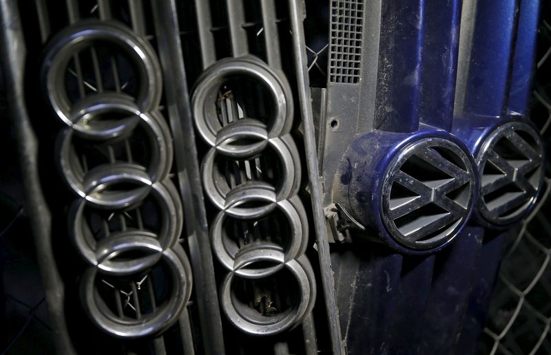 © Reuters. Picture illustration of Volkswagen and Audi hood masks in Jelah