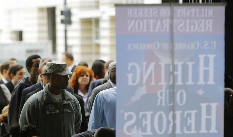 © Reuters. Job seekers line up outside a job fair held by the U.S. Chamber of Commerce and the Washington Nationals baseball club in Washington